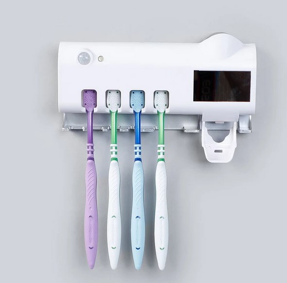 Wall mounted toothbrush holder with uv